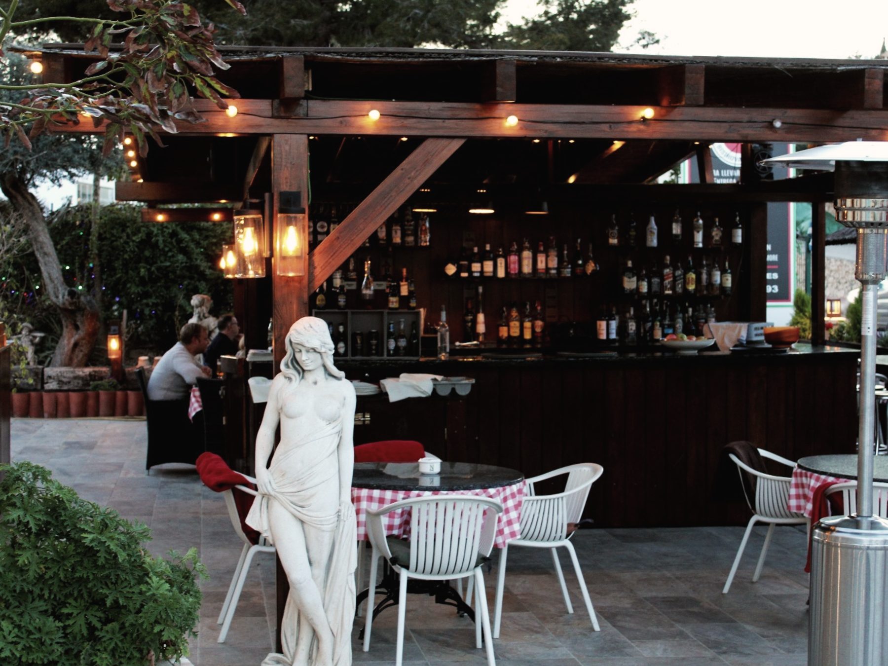 The terrace and bar at dusk